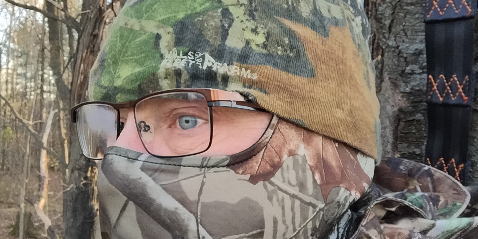 Deer hunter in tree stand