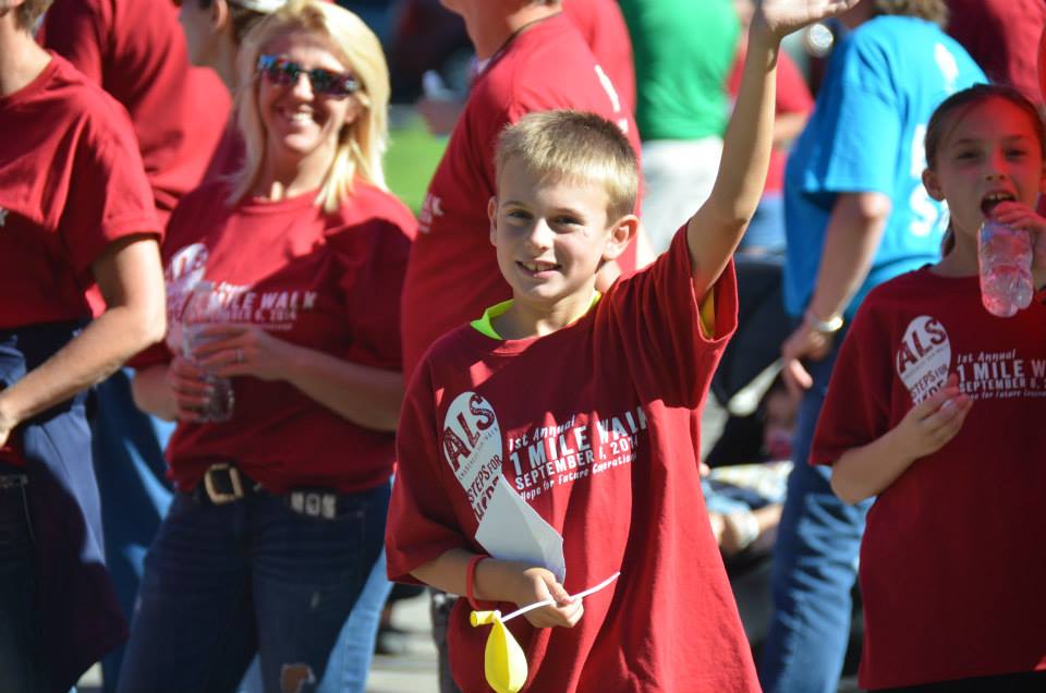 Child waving at ALS Run/Walk