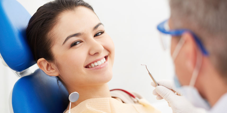 Girl smiling while visiting dentist